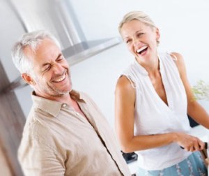 couple in kitchen laughing