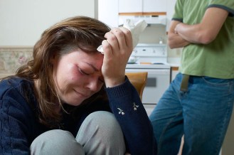 photoAbusedWomanCryingManBehindher
